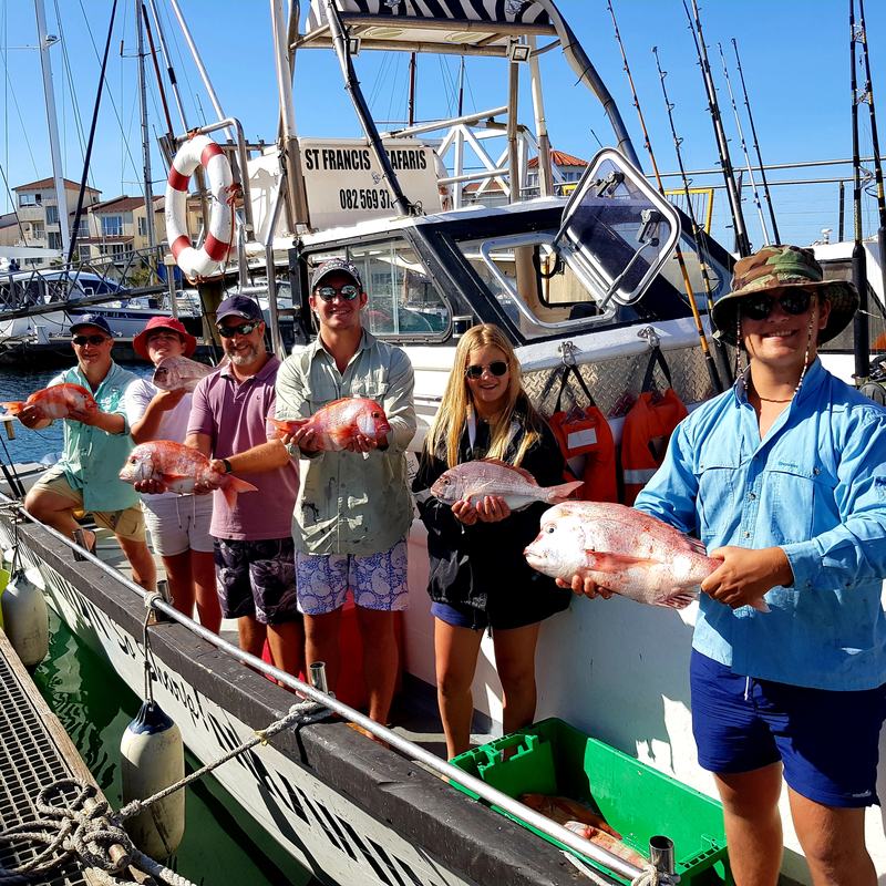 Guests with a catch of red roman
