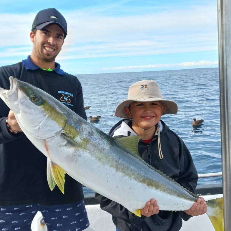 Father and son with a yellowtail